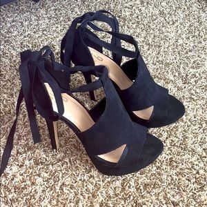 Black heels that lace up around the ankle